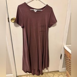 Long burgundy dress. Shorter in the front than in the back. Cotton dress.